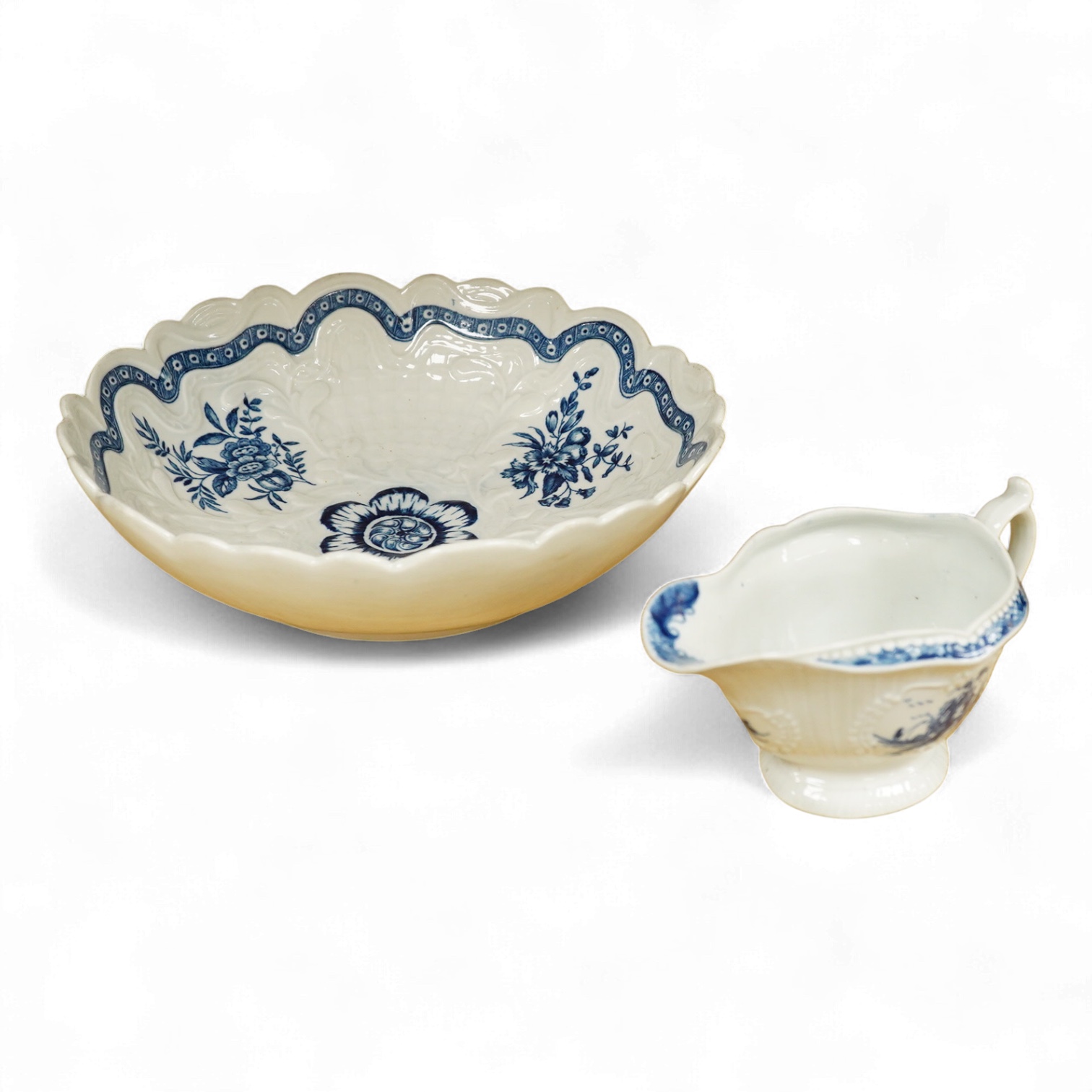 An 18th century Worcester junket dish and a jug, dish 23.5cm
